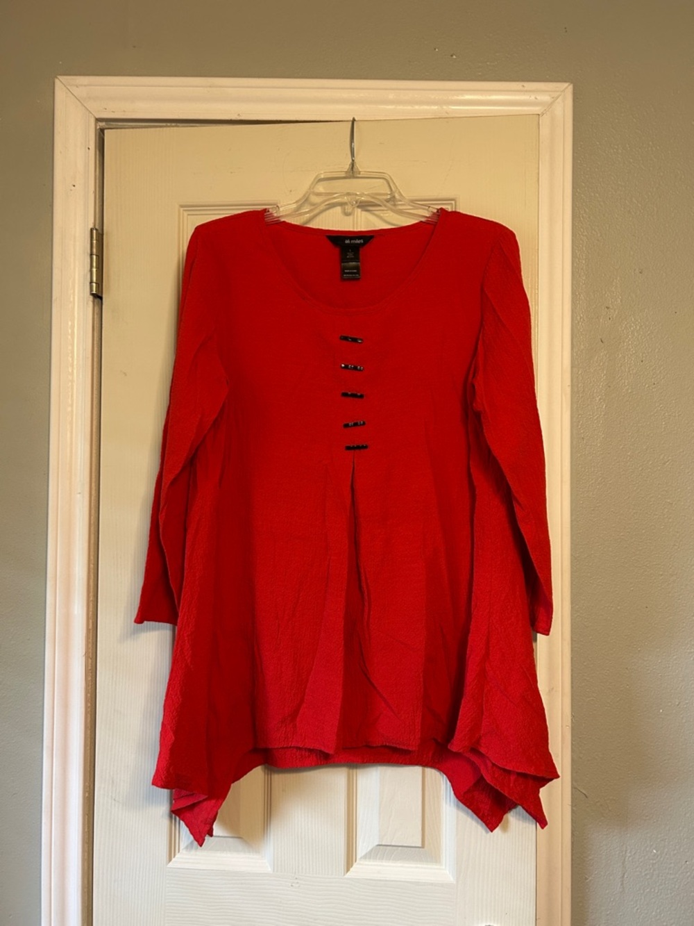 Ali Miles red tunic toll tab